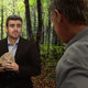 Illustration for article titled ‘Right This Way To The Debate Stage,’ Says Tearful, Rock-Holding Hickenlooper Aide Leading Candidate To Secluded Spot In The Woods